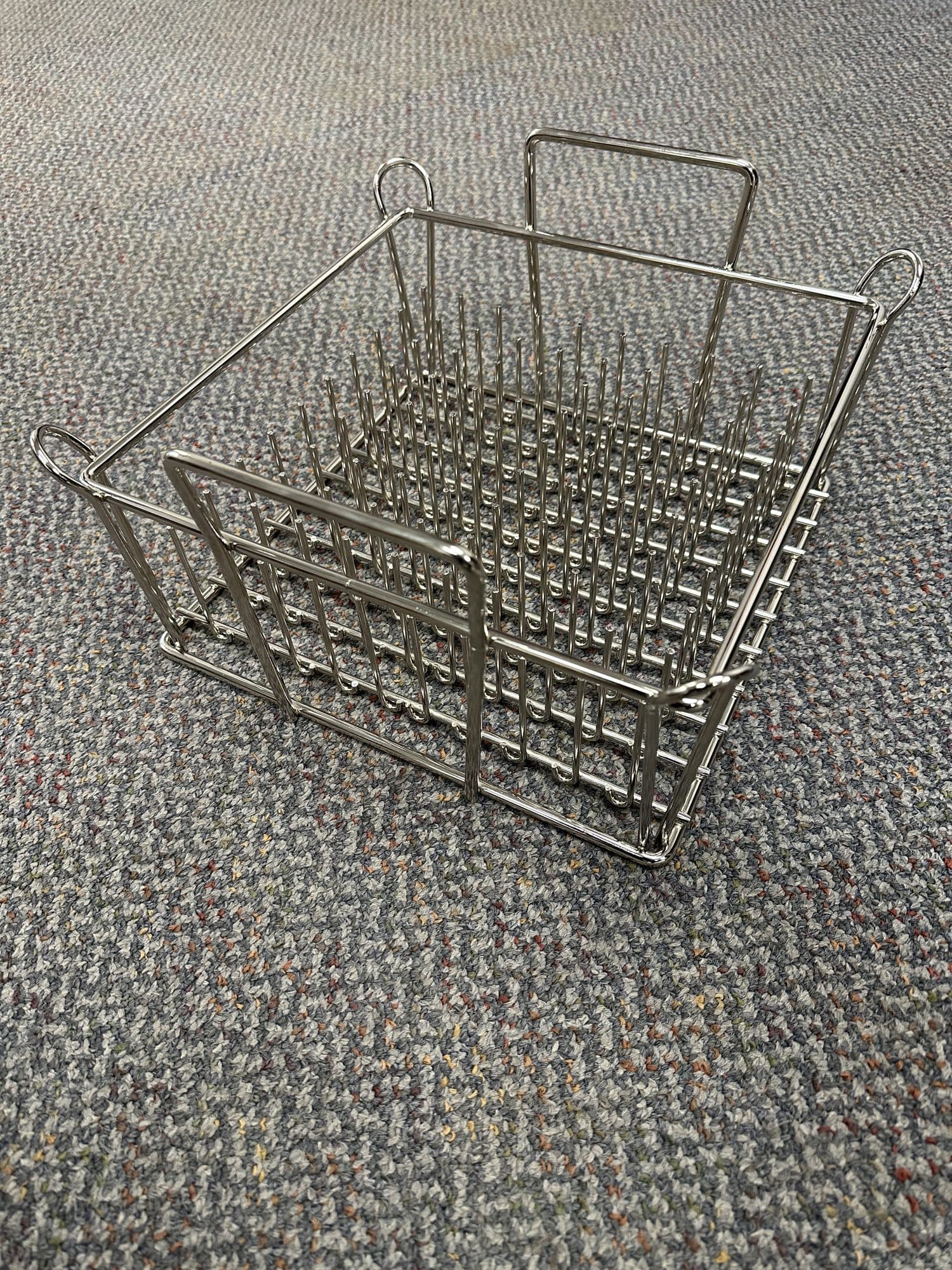 Wire wash basket with internal peg grid and carry handles