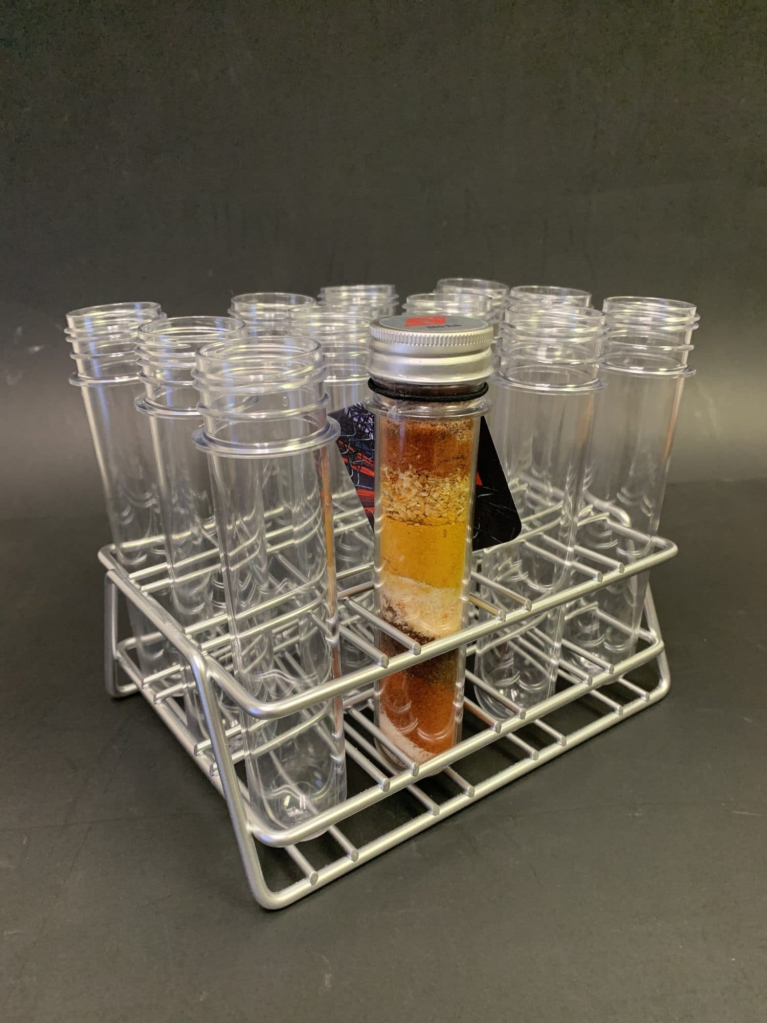 Wire laboratory test tube rack holding clear tubes