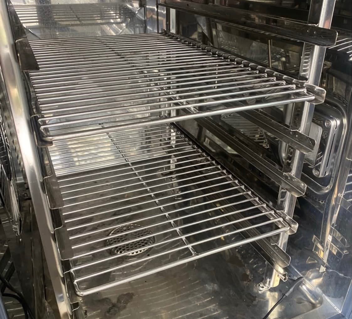 Chrome wire warming shelves in a heated holding cabinet