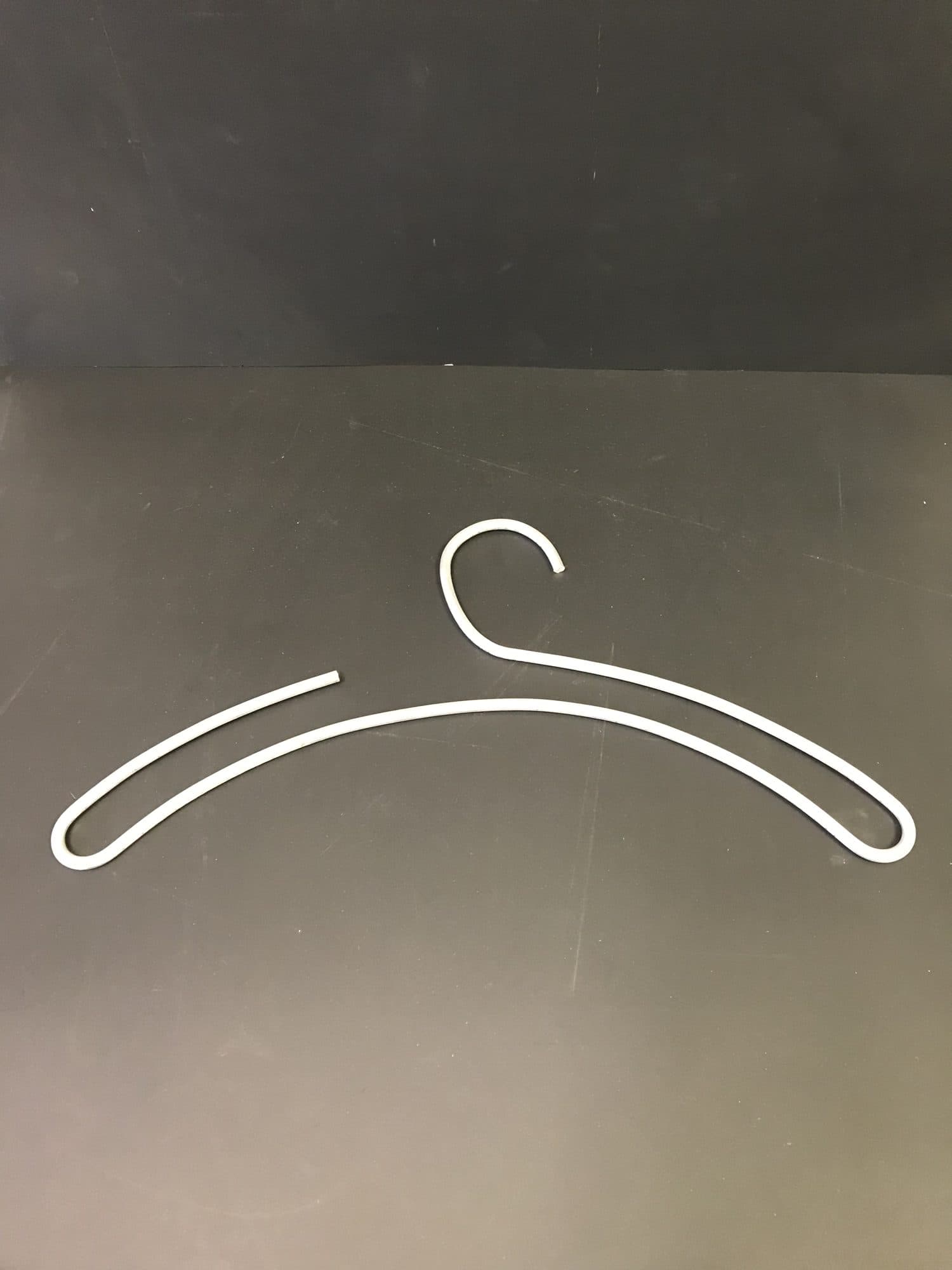 Bent coated wire garment coat hanger